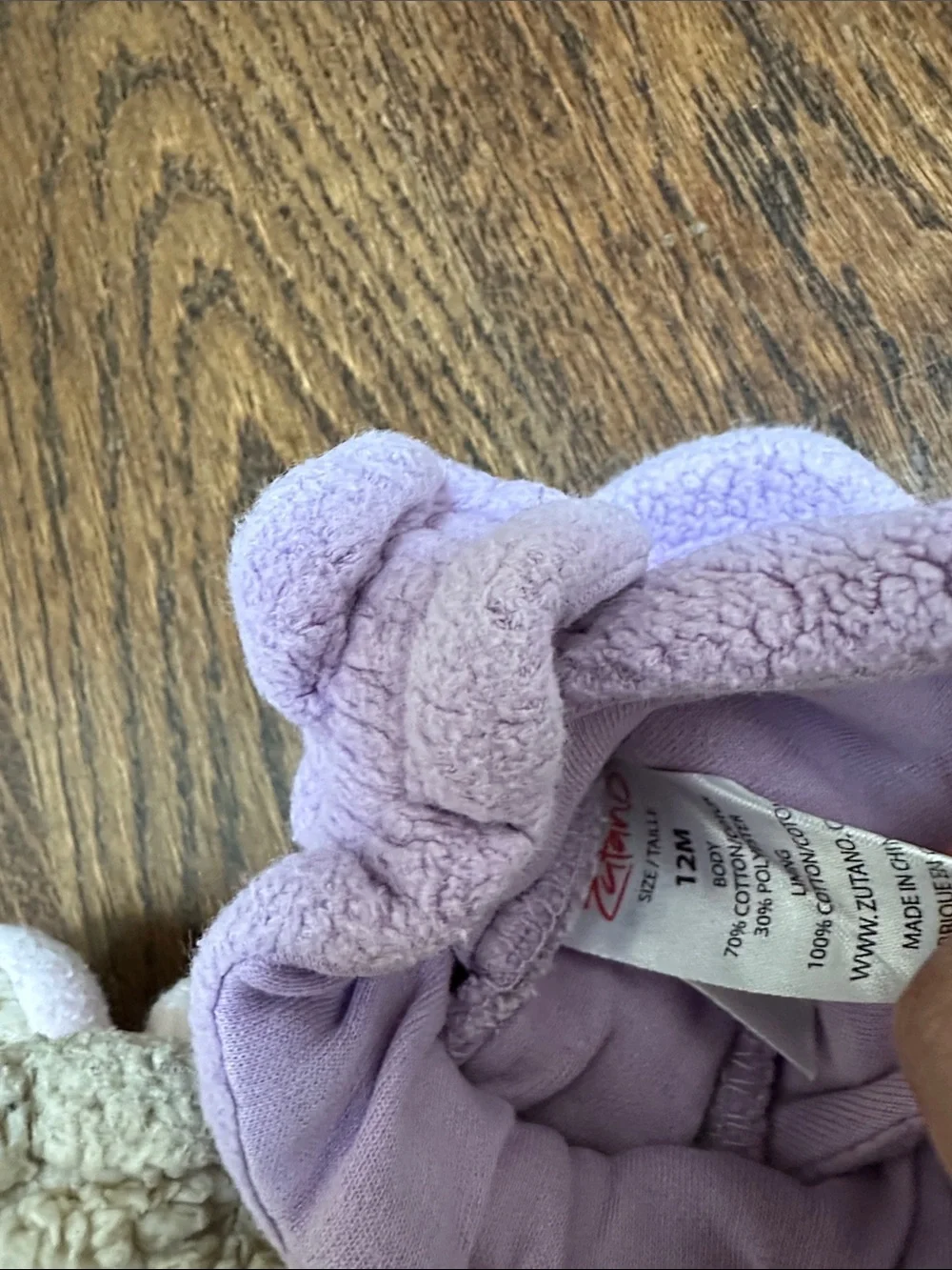 Two pairs of baby Zutano booties, 12M